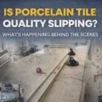 Large format porcelain slab being cut and installed during a bathroom installation, highlighting manufacturing and installation quality considerations